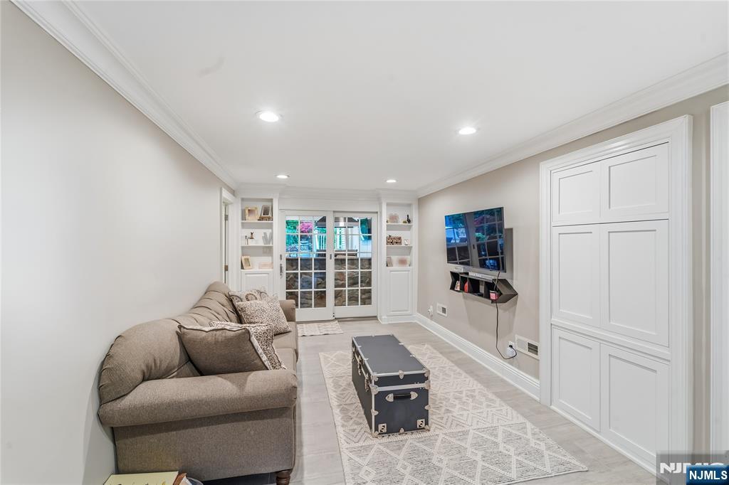 854 Cambridge Road River Vale, NJ 07675 - Photo 6 of 50 a living room with furniture and a flat screen tv