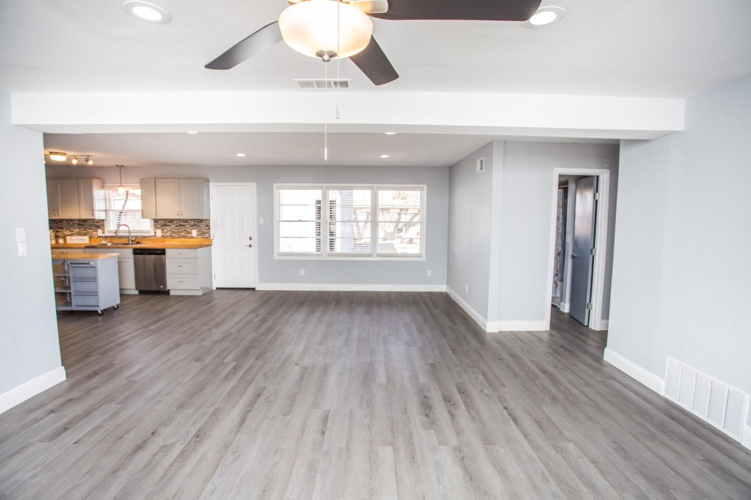 4804 44th Street Lubbock, TX 79414 - Photo 21 of 32 a view of a kitchen and window hardwood floor