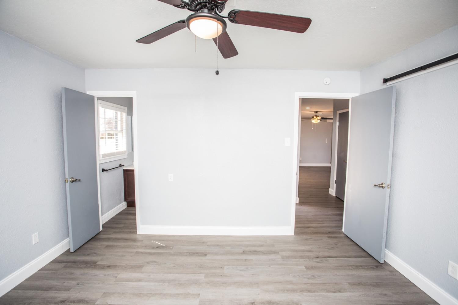 4804 44th Street Lubbock, TX 79414 - Photo 23 of 32 a view of an empty room and wooden floor