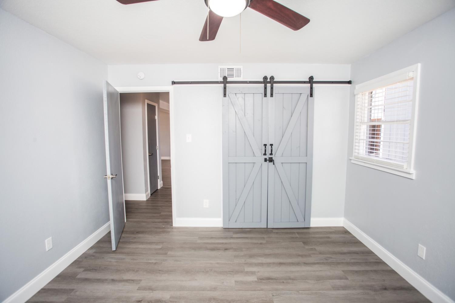 4804 44th Street Lubbock, TX 79414 - Photo 26 of 32 a view of entryway with wooden floor