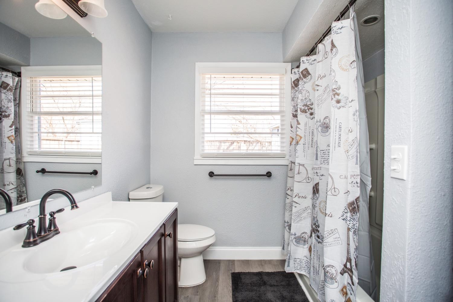 4804 44th Street Lubbock, TX 79414 - Photo 32 of 32 a bathroom with a sink toilet and window