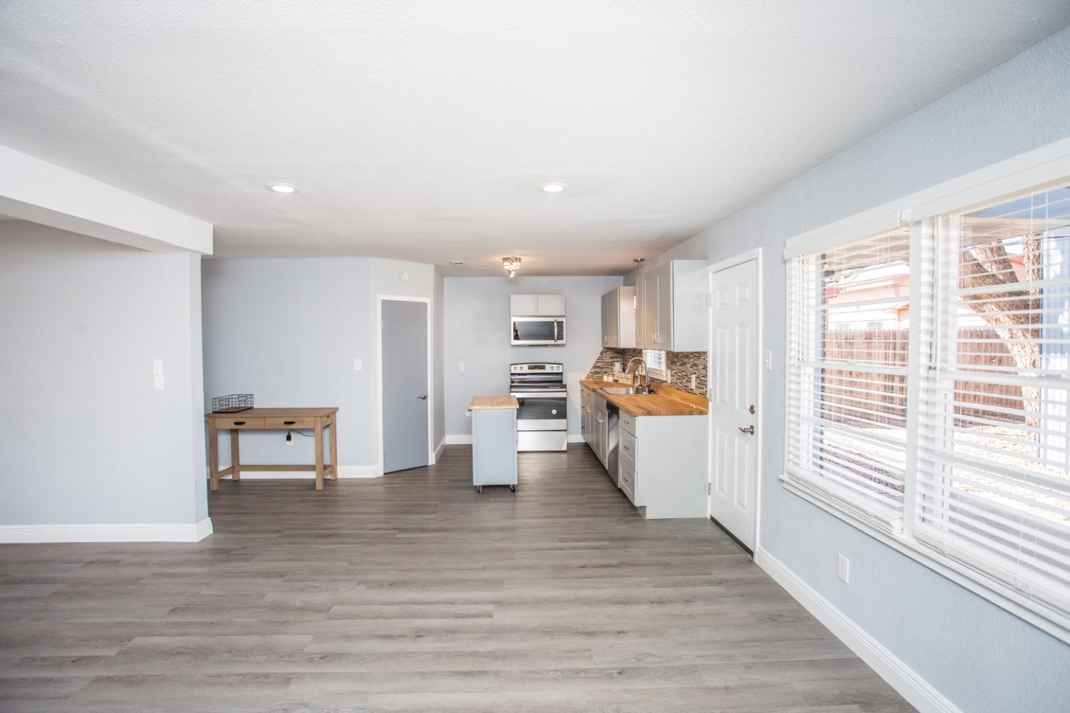 4804 44th Street Lubbock, TX 79414 - Photo 7 of 32 a view of kitchen with furniture and wooden floor