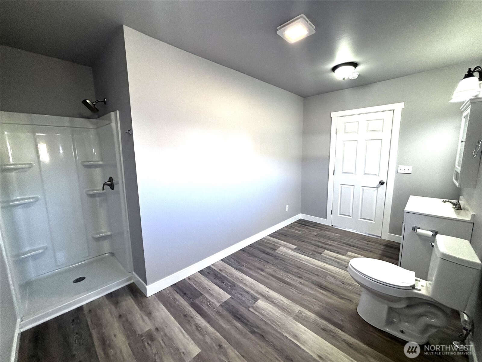 207 North Birch Street Odessa, WA 99159 - Photo 24 of 28 a bathroom with a toilet shower and a sink