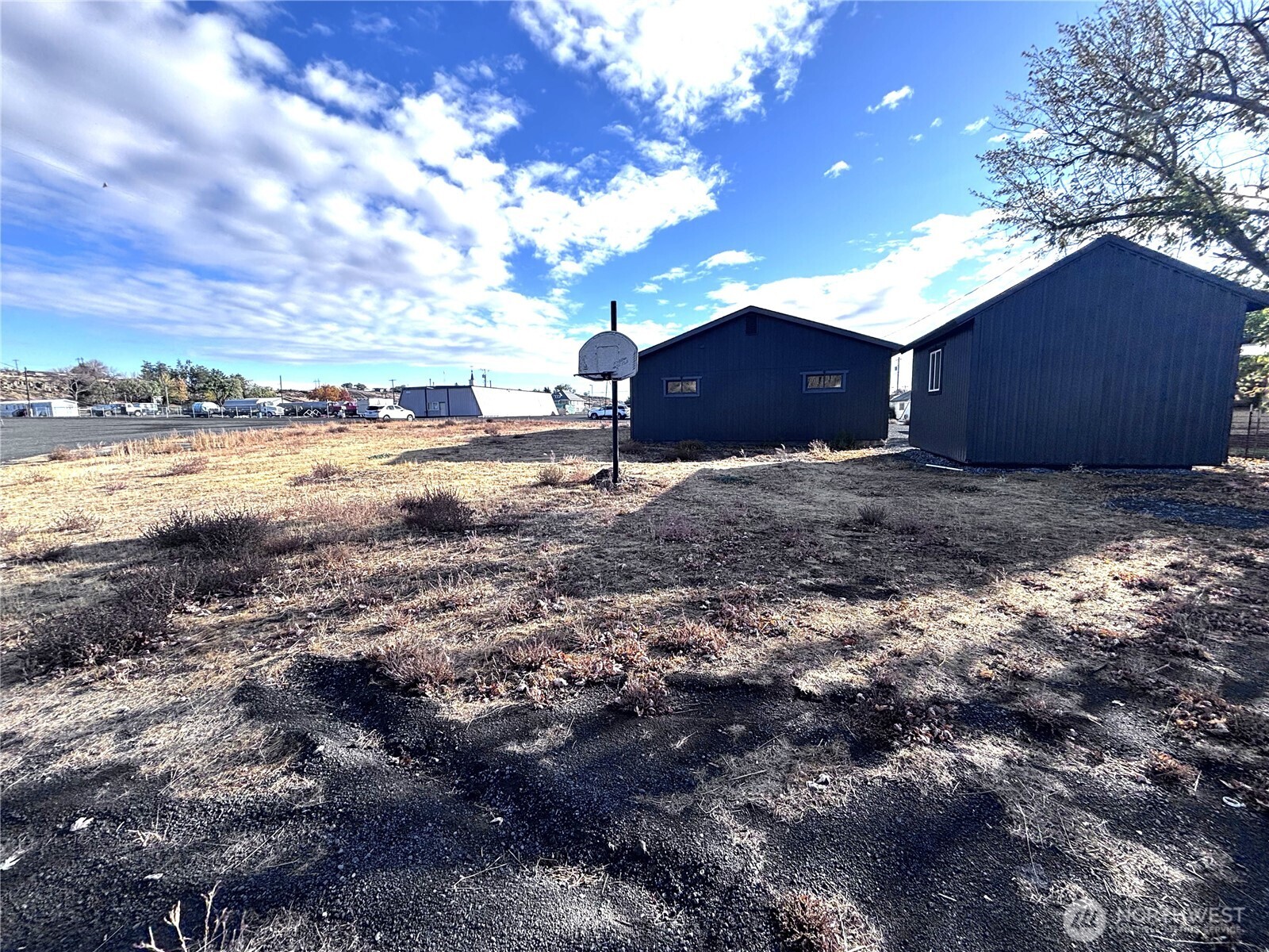 207 North Birch Street Odessa, WA 99159 - Photo 8 of 28 a view of a yard with wooden fence