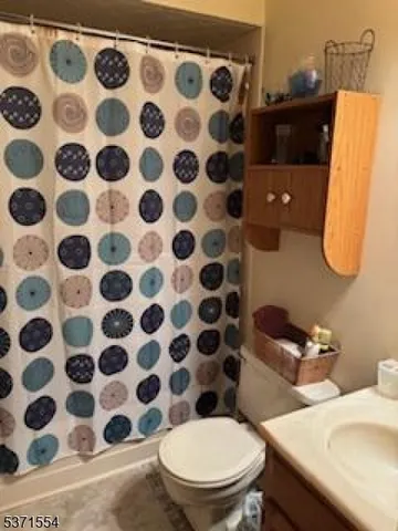 a spacious bedroom with a bed and a closet