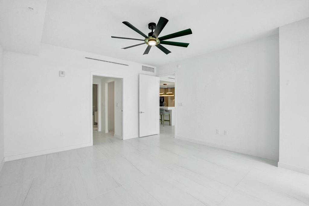 900 North Ocean Boulevard, Unit 1405 Pompano Beach, FL 33062 - Photo 22 of 67 a view of a livingroom with a ceiling fan and window