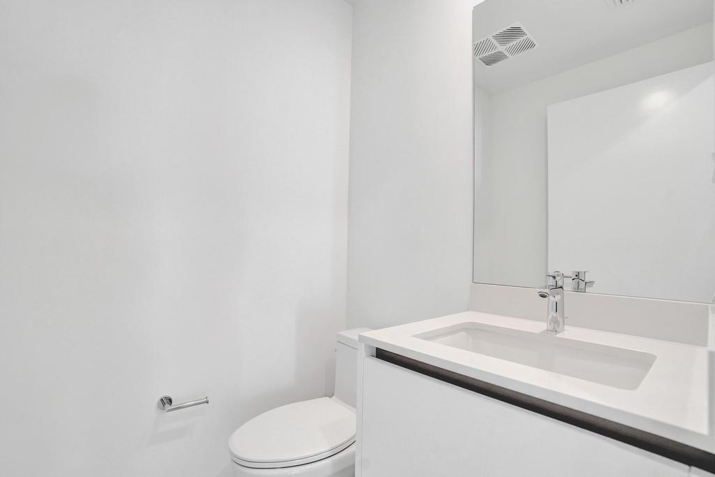 900 North Ocean Boulevard, Unit 1405 Pompano Beach, FL 33062 - Photo 38 of 67 a bathroom with a sink and toilet