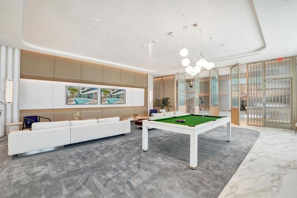 900 North Ocean Boulevard, Unit 1405 Pompano Beach, FL 33062 - Photo 54 of 67 a room with pool table and windows