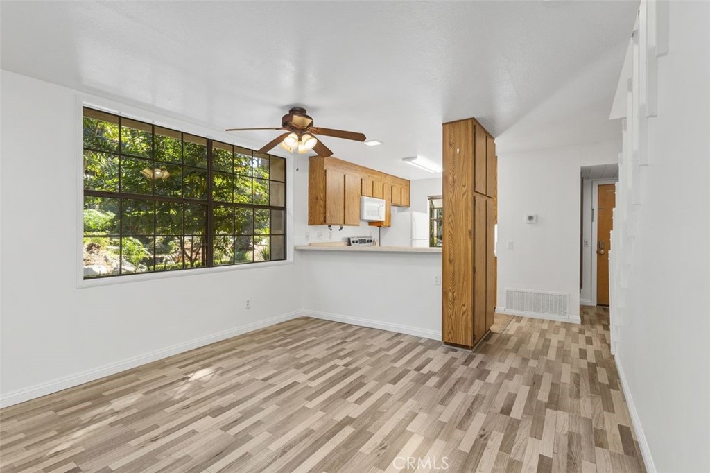 37 Lakepines Irvine, CA 92620 - Photo 14 of 55 a view of empty room with wooden floor and fan