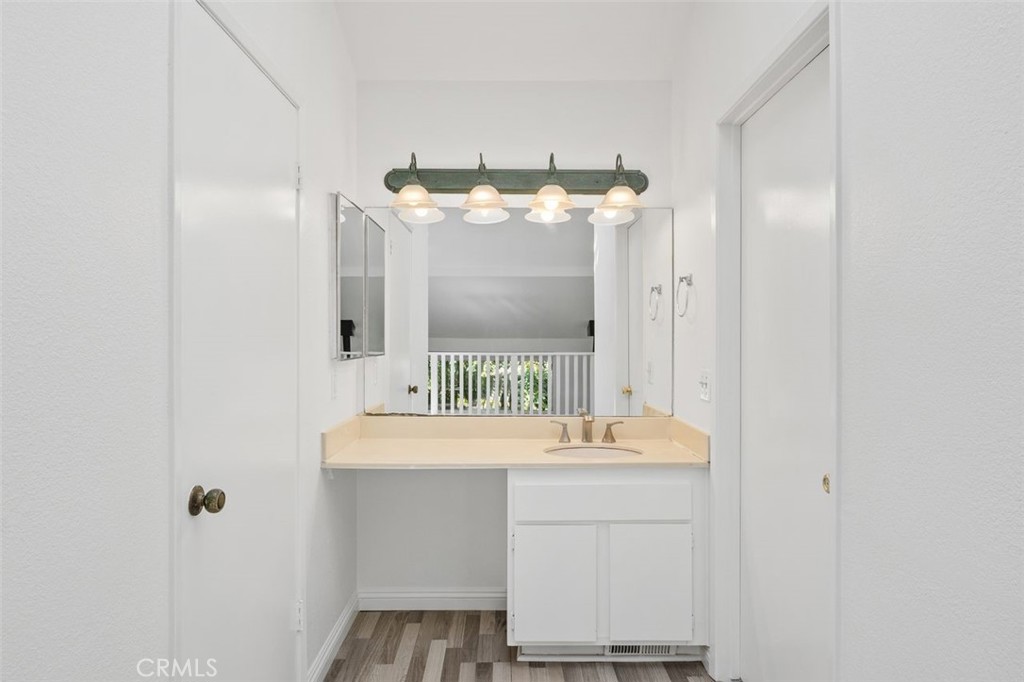 37 Lakepines Irvine, CA 92620 - Photo 18 of 55 a bathroom with a sink and a mirror