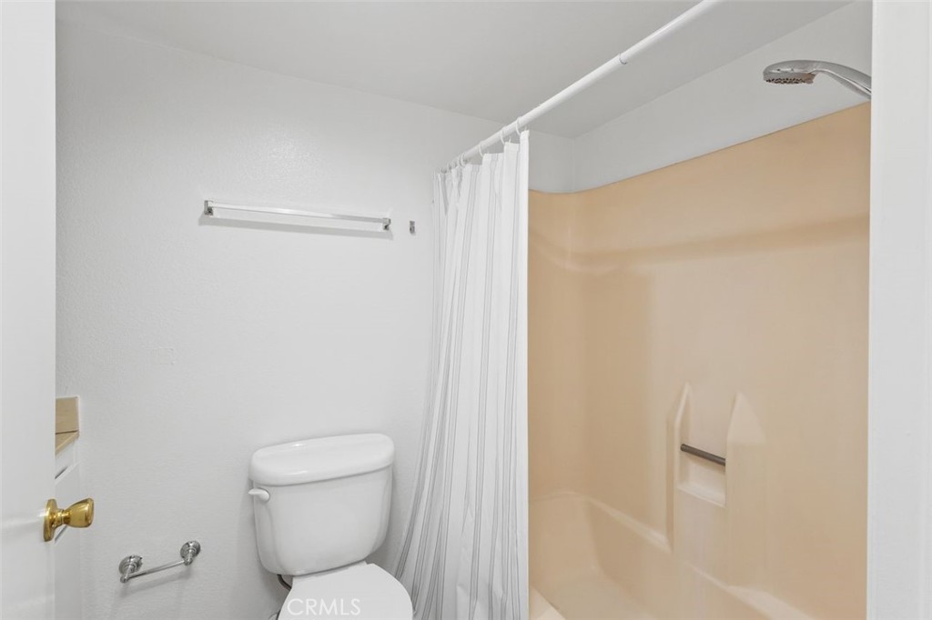 37 Lakepines Irvine, CA 92620 - Photo 19 of 55 a bathroom with a shower and a toilet