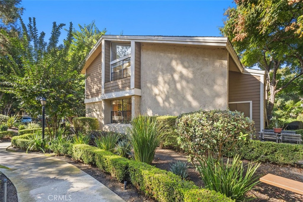 37 Lakepines Irvine, CA 92620 - Photo 2 of 55 a front view of a house with garden