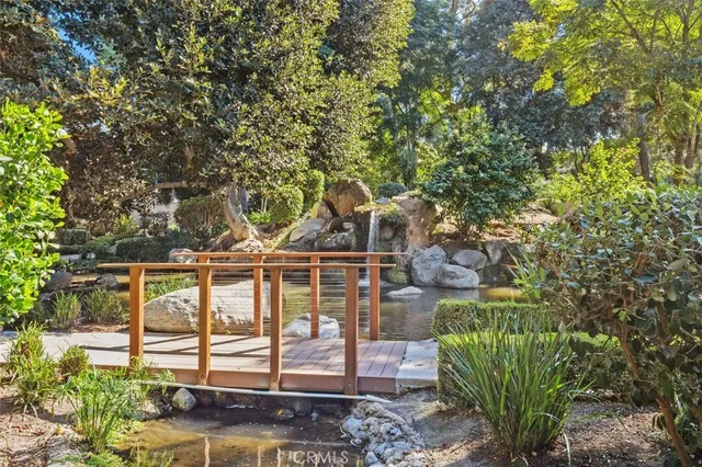 a view of a swimming pool with some trees