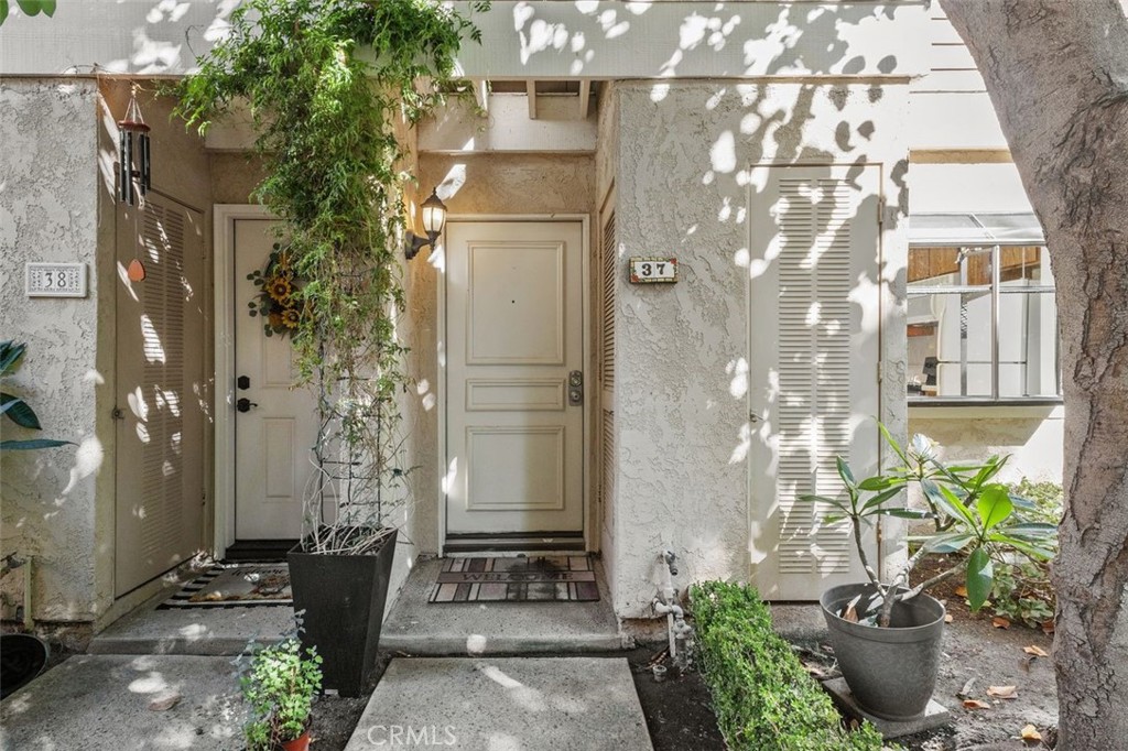 37 Lakepines Irvine, CA 92620 - Photo 3 of 55 a potted plant sitting in front of a building