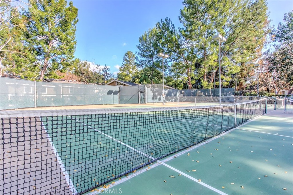 37 Lakepines Irvine, CA 92620 - Photo 40 of 55 a view of a tennis net and a tennis court
