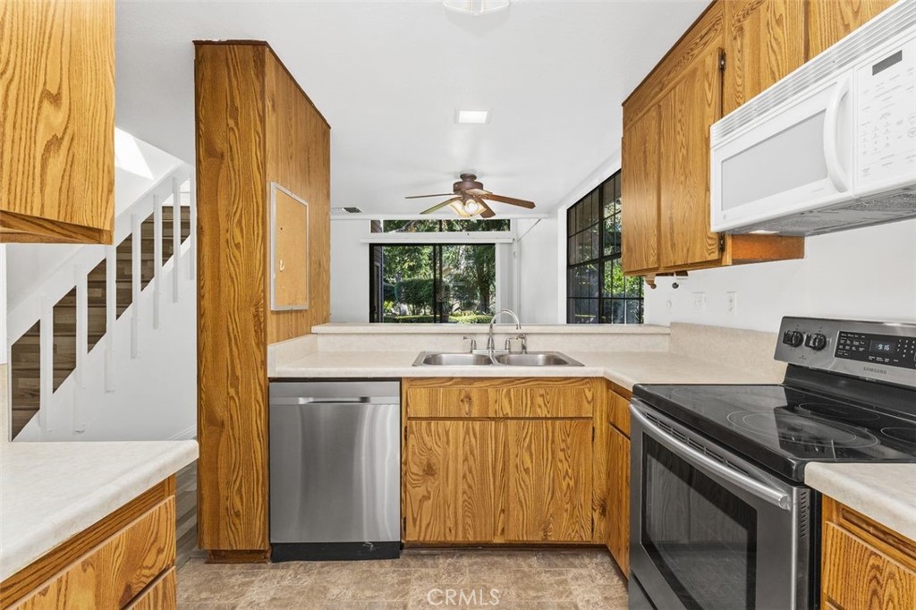37 Lakepines Irvine, CA 92620 - Photo 7 of 55 a kitchen with a stove and a sink