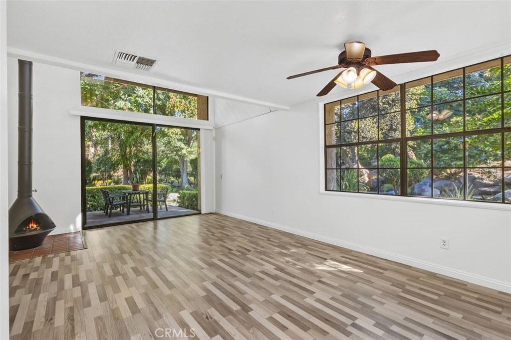 37 Lakepines Irvine, CA 92620 - Photo 9 of 55 a view of empty room with wooden floor and fan