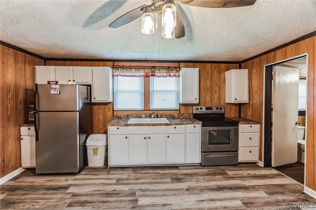 381 Moses Mill Road Chatham, VA 24531 - Photo 12 of 31 a kitchen with a refrigerator and a stove