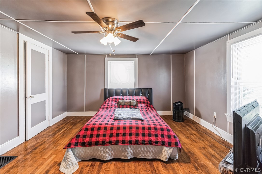 381 Moses Mill Road Chatham, VA 24531 - Photo 16 of 31 a bedroom with a bed and a chandelier