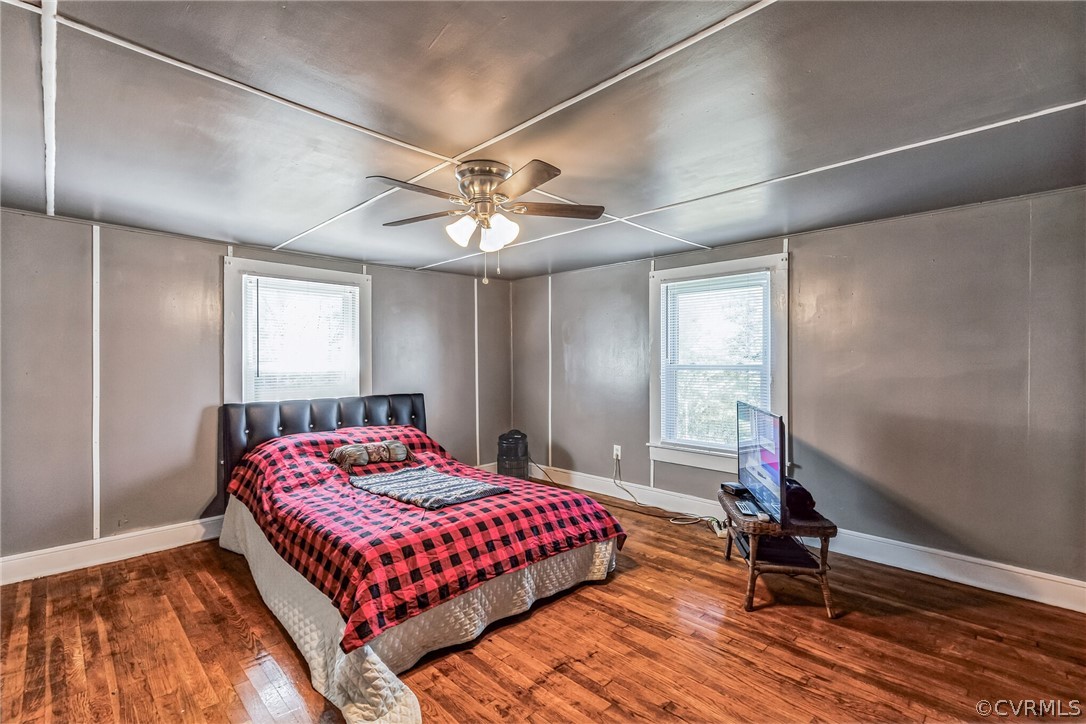 381 Moses Mill Road Chatham, VA 24531 - Photo 17 of 31 a bedroom with a bed and a chandelier