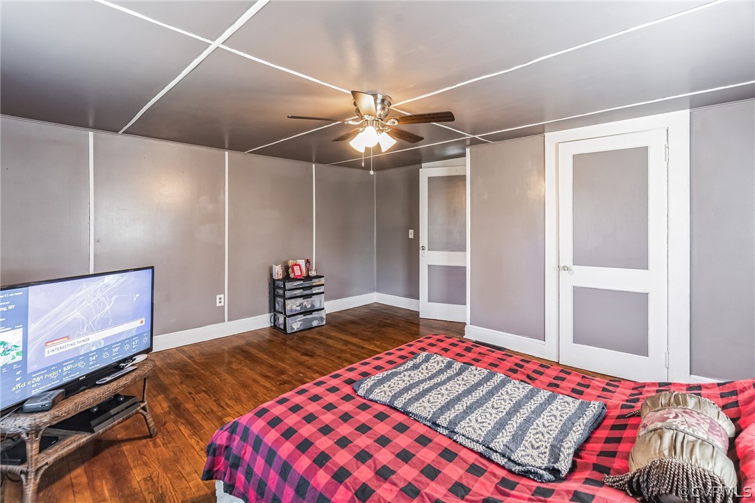 381 Moses Mill Road Chatham, VA 24531 - Photo 18 of 31 a bedroom with a bed and a chandelier