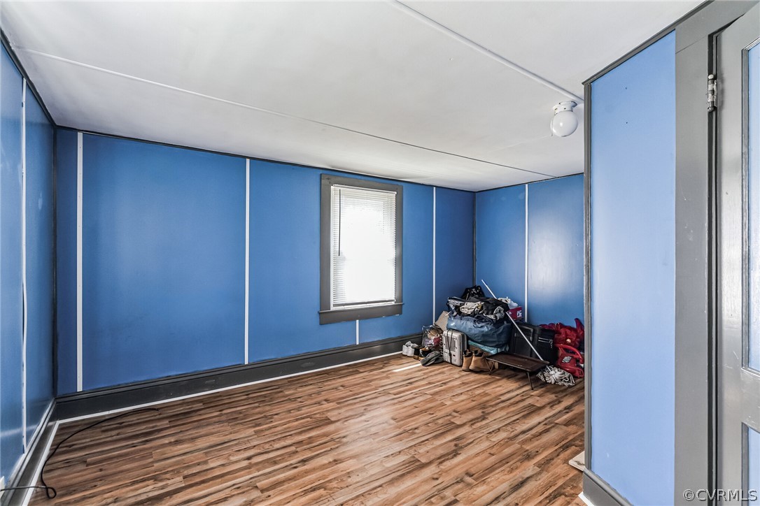 381 Moses Mill Road Chatham, VA 24531 - Photo 20 of 31 a room with wooden floor and furniture