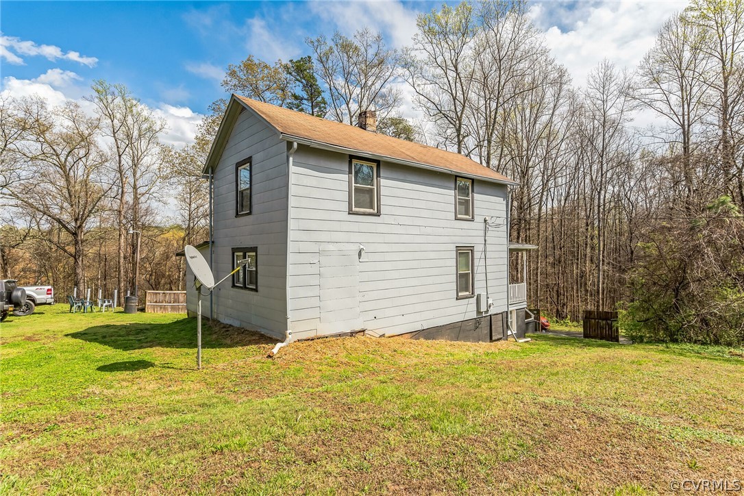 381 Moses Mill Road Chatham, VA 24531 - Photo 27 of 31 a view of a house with a yard and garage