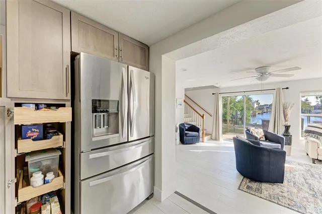 a kitchen with stainless steel appliances granite countertop a refrigerator and a stove