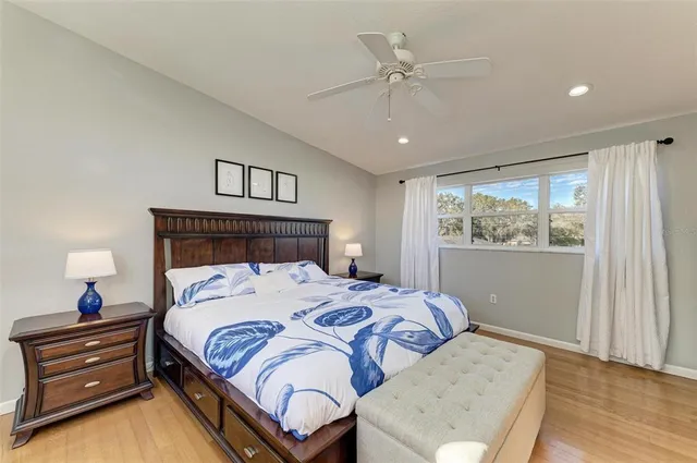 a bedroom with a bed and a window