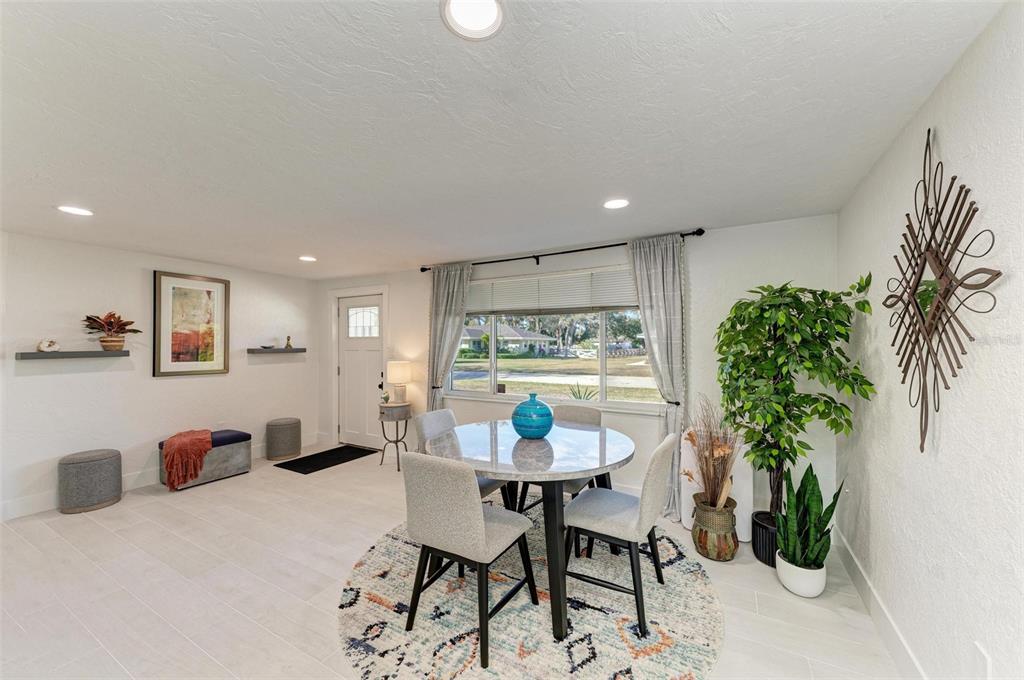 3311 Water Street Ellenton, FL 34222 - Photo 5 of 41 a view of a dining room with furniture and a potted plant