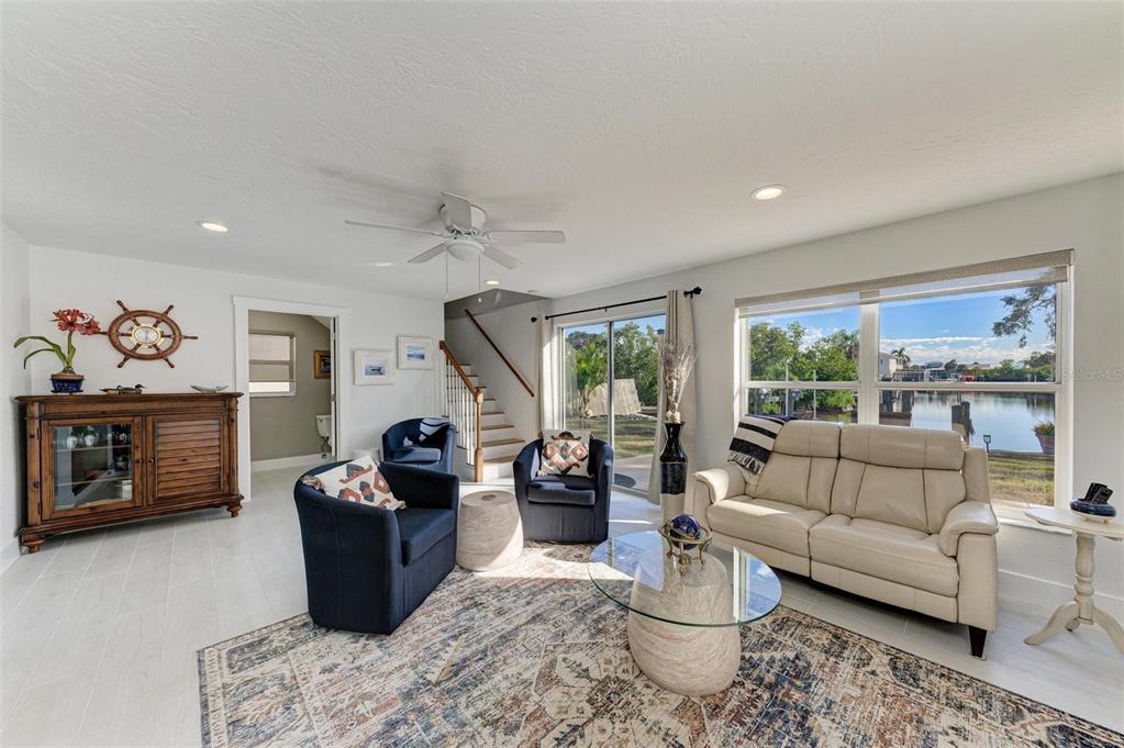3311 Water Street Ellenton, FL 34222 - Photo 8 of 41 a living room with furniture a flat screen tv and a large window