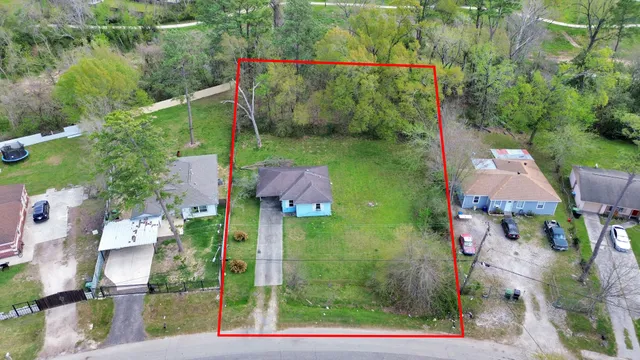 an aerial view of houses with yard