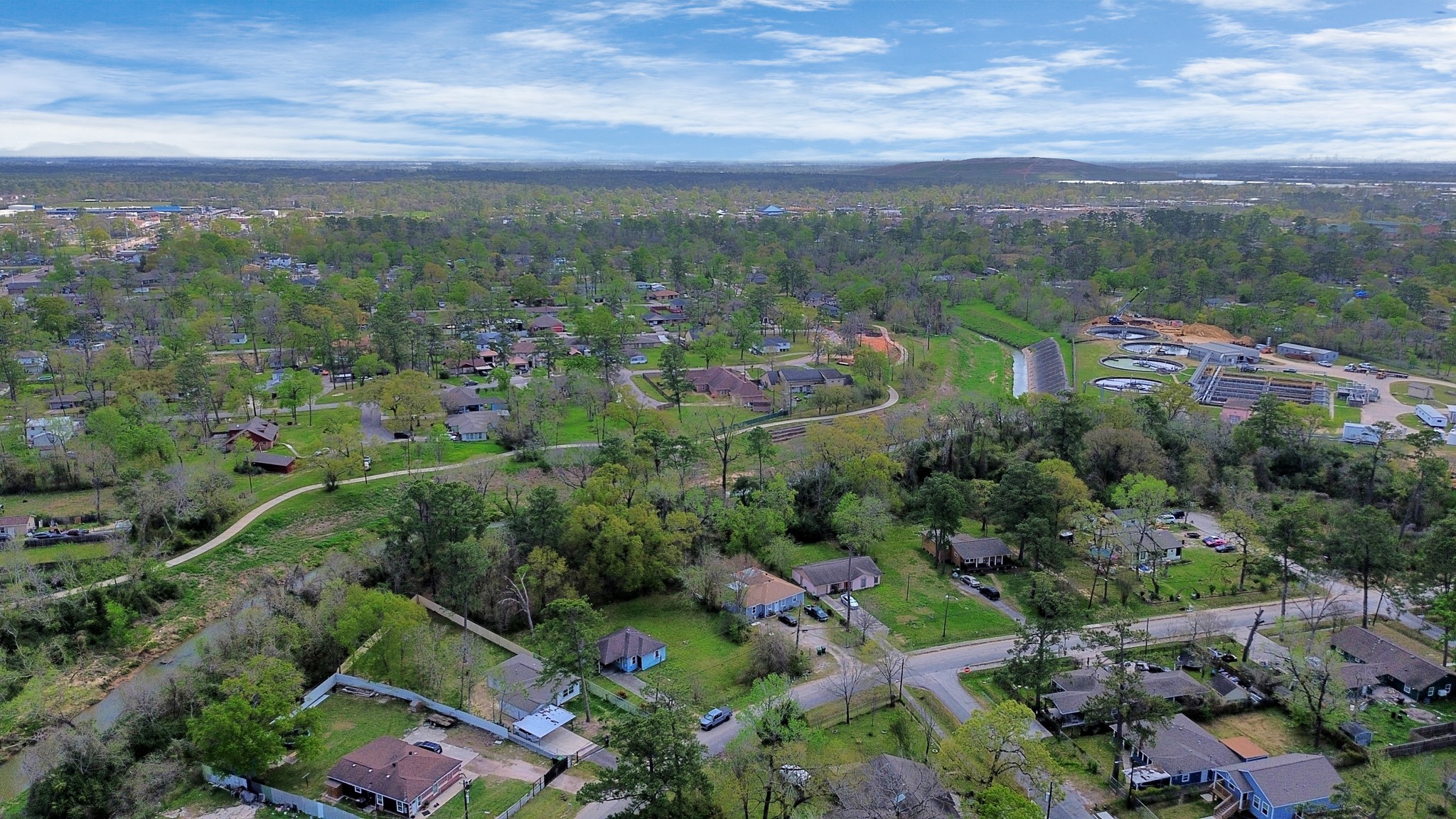 8181 Count Street Houston, TX 77028 - Photo 12 of 12 a view of a city with lush green forest