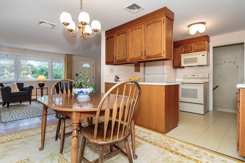 4 Seneca Road Woburn, MA 01801 - Photo 6 of 27 a view of a dining room with furniture and chandelier