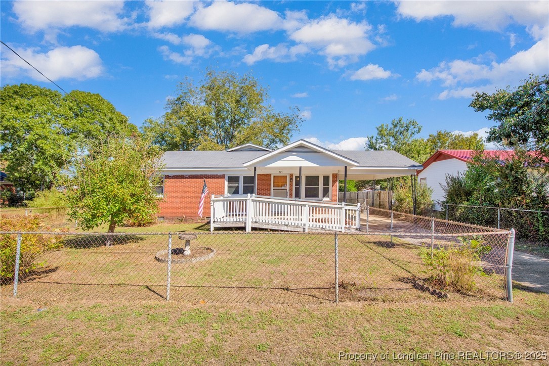 215 South 7th Street Spring Lake, NC 28390 - Photo 2 of 37 a front view of house with yard