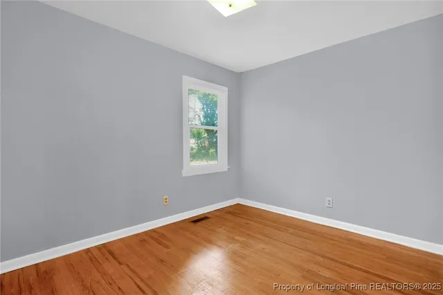 a view of an empty room with a balcony