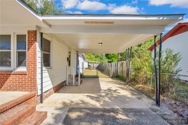 a view of a backyard with patio