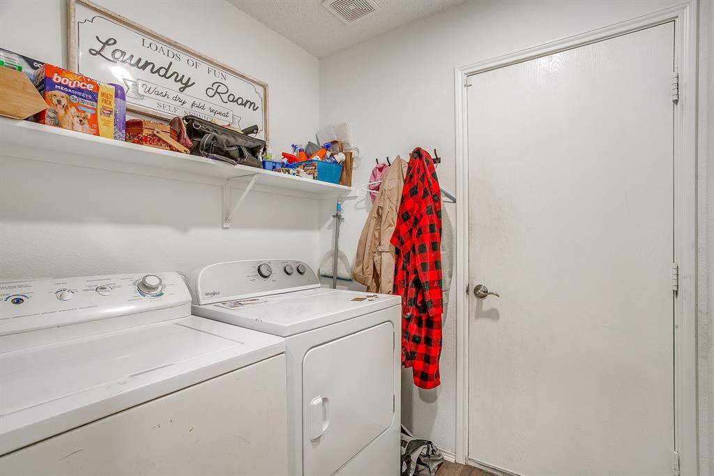 5441 Temecula Road Fort Worth, TX 76244 - Photo 29 of 33 Dedicated laundry space featuring a white washer and dryer, an overhead storage shelf, and light-toned flooring