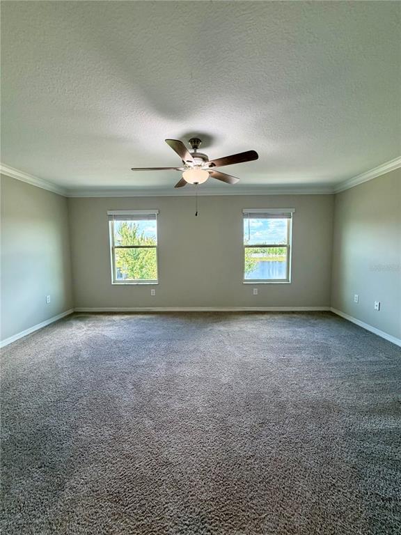 11826 Dumaine Valley Road Riverview, FL 33579 - Photo 19 of 54 a view of a livingroom with a ceiling fan and window