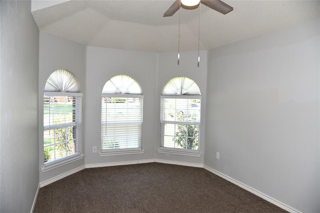 1526 Pebblestone Court Allen, TX 75002 - Photo 20 of 28 Bay window with three arched windows, each featuring horizontal blinds and pleated arch shades