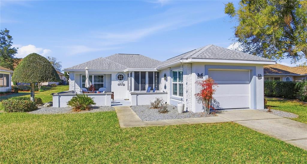11230 Southwest 72nd Avenue Ocala, FL 34476 - Photo 1 of 1 a front view of a house with garden