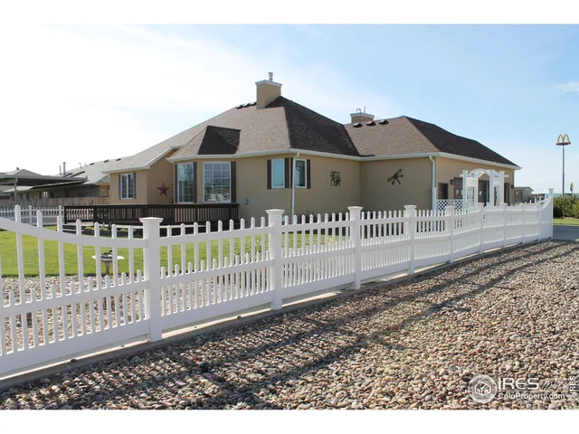 a front view of a house with a fence