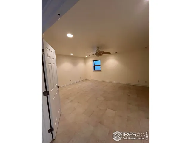 a view of a hallway with a bathroom