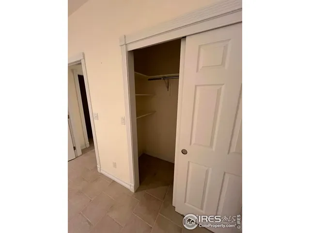 a kitchen with a stove cabinets and a refrigerator