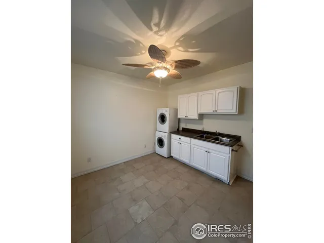 a view of a hallway with windows and brick walls