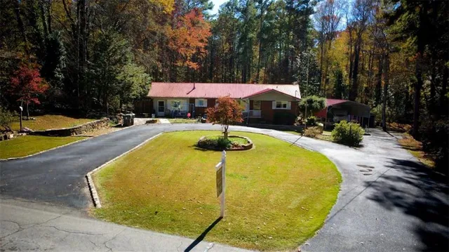 a swimming pool with outdoor seating and yard