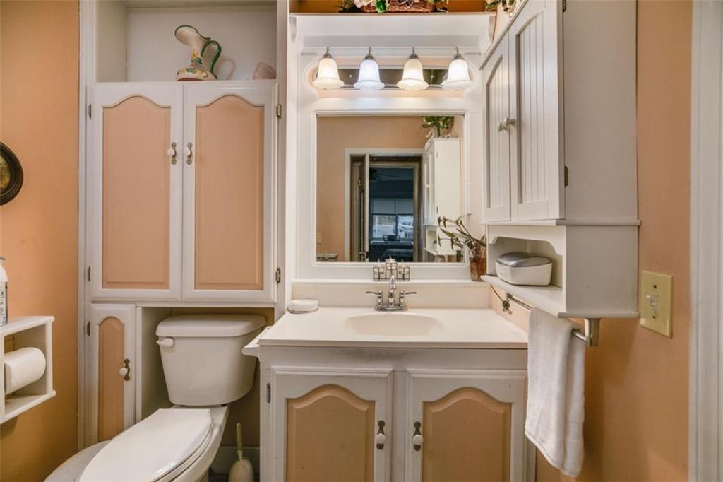 809 Laurel Street Bremen, GA 30110 - Photo 11 of 34 a bathroom with a sink vanity mirror and toilet