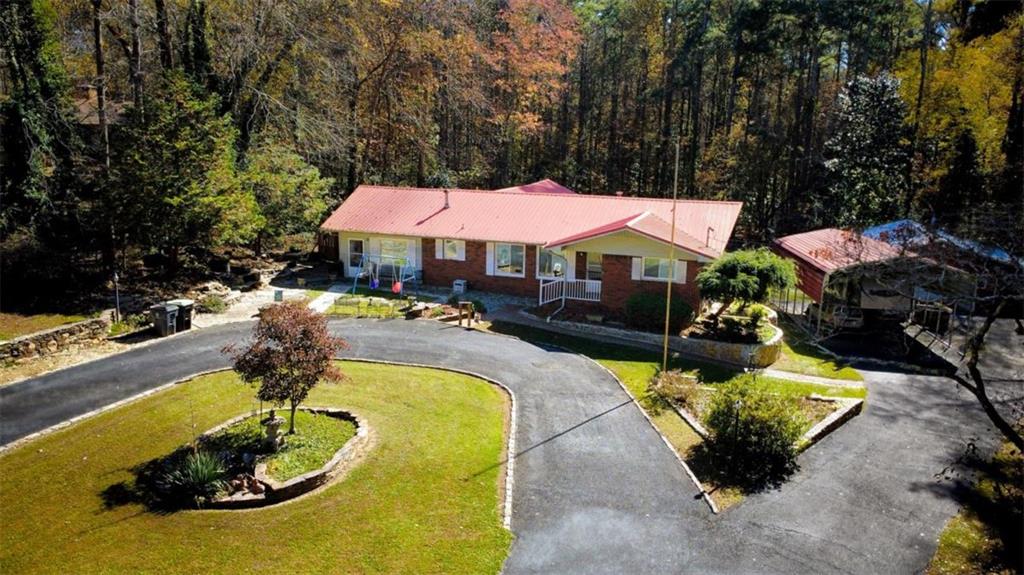 809 Laurel Street Bremen, GA 30110 - Photo 2 of 34 a swimming pool with outdoor seating and yard