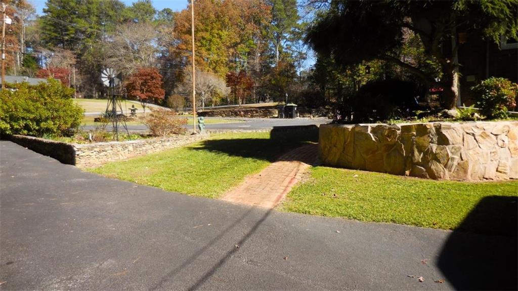 809 Laurel Street Bremen, GA 30110 - Photo 23 of 34 a view of yard with swimming pool and trees in the background
