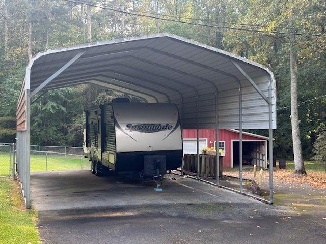 809 Laurel Street Bremen, GA 30110 - Photo 30 of 34 a view of a house with a patio and a yard